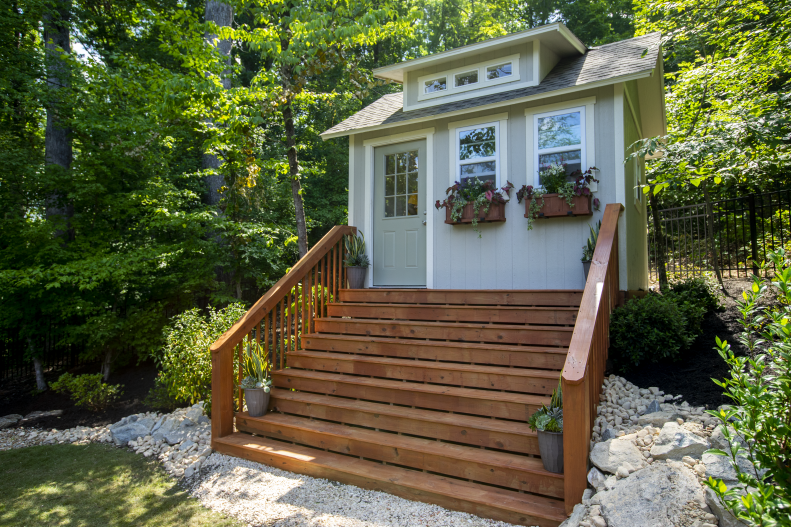 Sherrod decided to elevate the entry to her shed and "constructed a grand staircase to create an exciting entryway and show some personality up front. Just because it might be called a 'shed,' doesn't mean it has to look like your typical shed," she says.