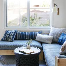 Window Seat With Blue Bolsters