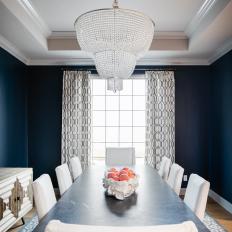 Dining Room with Tray Ceiling and Elegant Chandelier