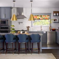 Transitional Eat In Kitchen With Gold Pendants