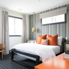 Gray and Orange Contemporary Bedroom With Gold Sconces