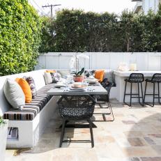 Patio Dining Area With Striped Bench Cushion