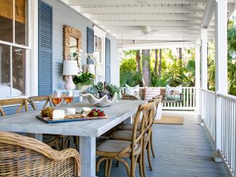 A wide welcoming back porch offers lots of entertaining space and a gorgeous view of the marsh in this charming Savannah home.