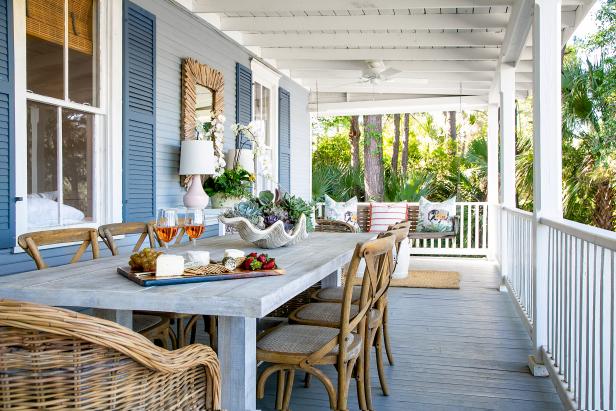 A wide welcoming back porch offers lots of entertaining space and a gorgeous view of the marsh in this charming Savannah home.