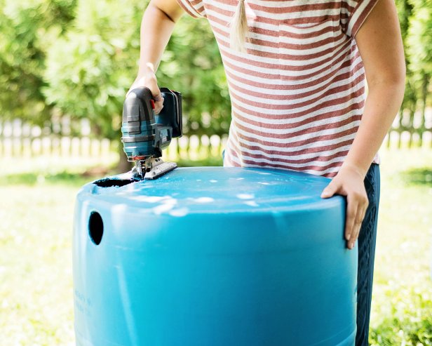 On the barrel, cut out opening for the downspout with a jigsaw.