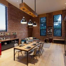Modern Loft Dining Area with Built-In Bar and Pendant Lights