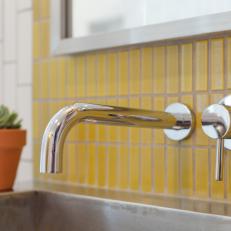 Wall Mounted Faucet on Mustard Yellow Tile Wall 