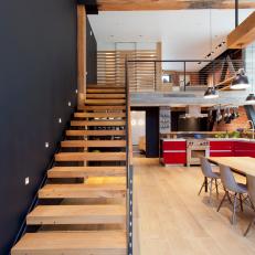 Loft Stairwell with Open Risers and Exposed Beam Ceiling