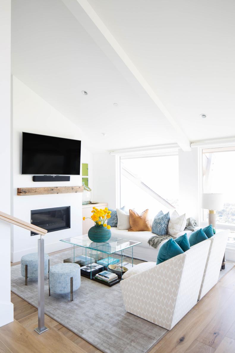 Coastal Family Living Room with White Couch and Glass Table