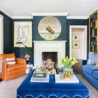 Living Room with Blue Wall, Couch and Upholstered Table