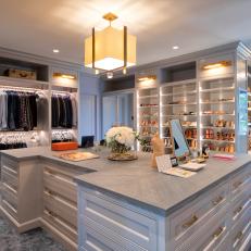 Spacious Master Closet With Shoe Shelves and Central Island