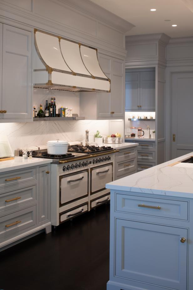 Kitchen With Dual Gas Ovens And French Country Range Hood Hgtv