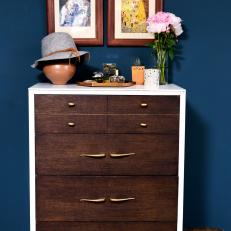 White Dresser With Wood Drawers Pops Against Navy Blue Walls