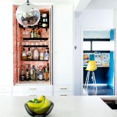 Kitchen Cabinetry Includes Spot for Stylish Liquor Cabinet