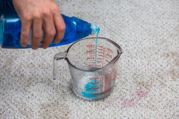 Create a cleaning solution using dish soap and hydrogen peroxide.