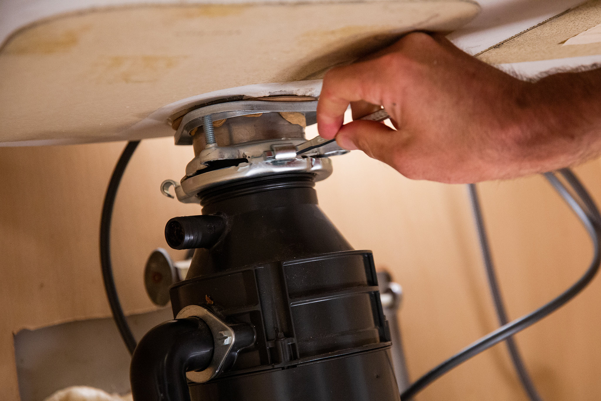 how to remove a garbage disposal drain