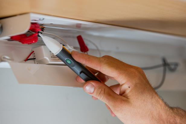 When removing lighting from kitchen cabinets, make sure that there is no power running to the lighting by using a current finder.
