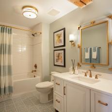 Modern Guest Bathroom with Gold and Blue Accents 