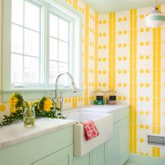 Eclectic Yellow Laundry Room With Blue Cabinets