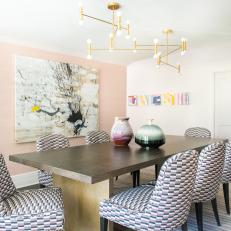 Pink Contemporary Dining Room With Gold Chandelier