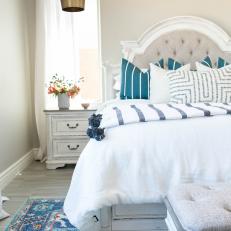 Neutral Transitional Bedroom With Tufted Headboard