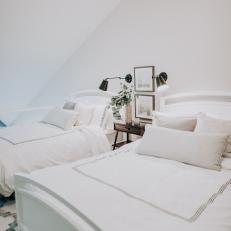 Guest Room With Vaulted Ceilings And Two Beds