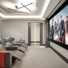 Gray Home Theater With Red Throw