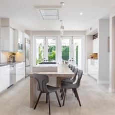 White Modern Eat-In Kitchen With Gray Chairs