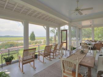 Large Screened Porch On Farmhouse With Rocking Chairs