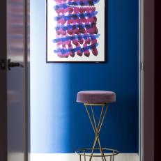 Navy Blue Hallway With Purple Velvet Stool
