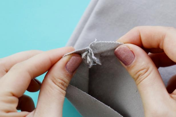 After cutting the mouth for the shark beach bag, add stitches to the inside of the seam so it doesn't unravel.