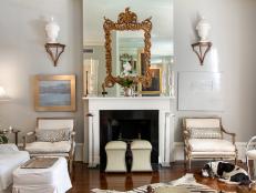 A crisp, clean color palette of creams, ivories and gold lend this Savannah living room its elegant feel.