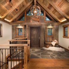 Rustic Foyer With Wolf Art