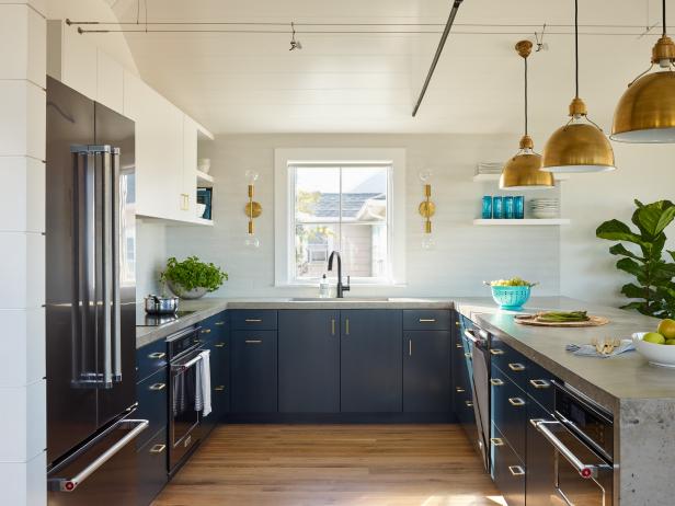 Kitchen with Navy Blue and White Cabinets and Concrete Countertops