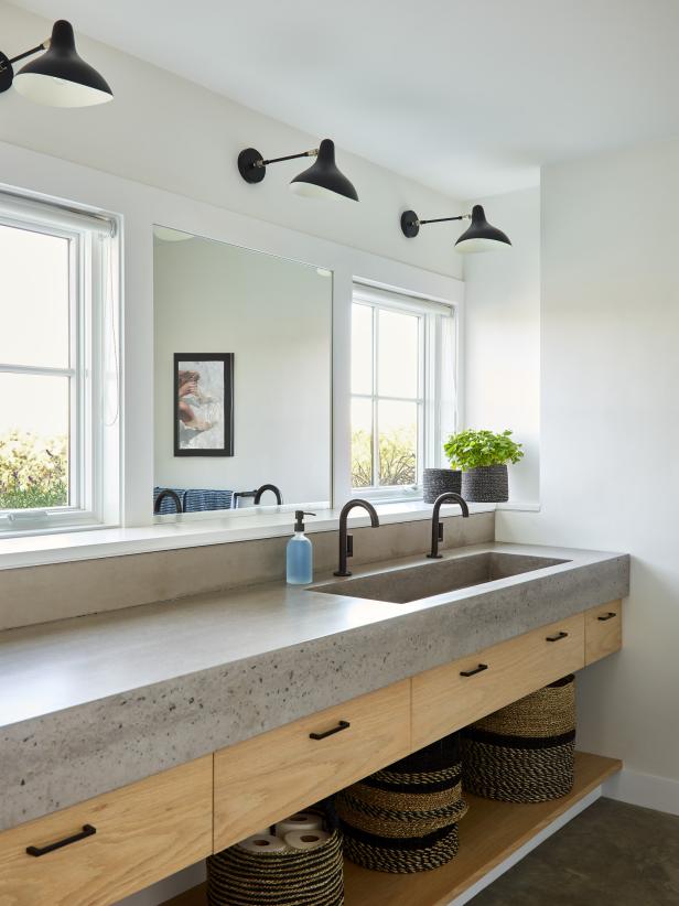 Bathroom With Concrete Counter and Floor