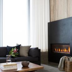 Black And Wood Living Room With Gas Fireplace