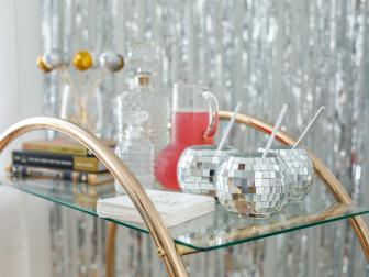 A Bar Cart Against a Shimmery Background at Party
