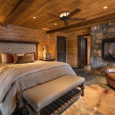Rustic Master Bedroom with Raised Fireplace 