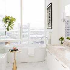 Sleek, White Bathroom With Soaking Tub