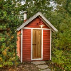 Storage Shed Surrounded by Evergreens