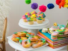 A Table Full of Color Tie-Dye Desserts on Plates
