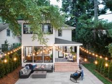 Large Backyard Patio Seating Area With Bistro Lights