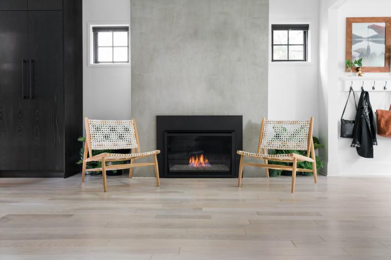 Concrete Fireplace Flanked by Wood-Framed Chairs