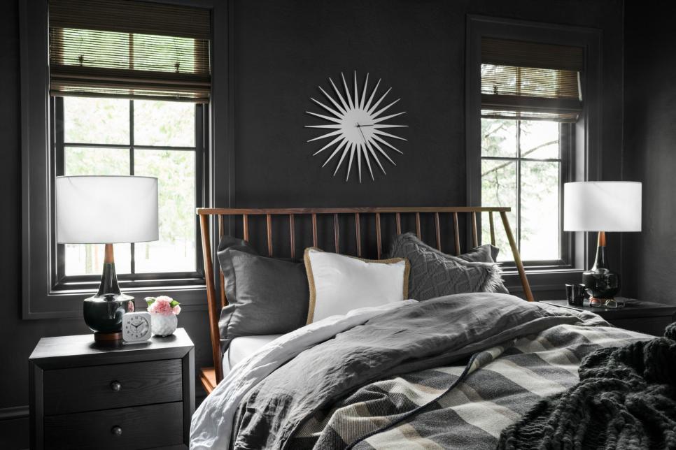 Bright White Clock on Wall Above Wood-Framed Bed With Neutral Bedding