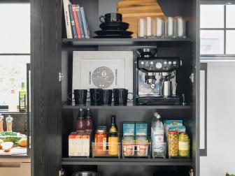 Black Pantry Cabinet With Open Doors Displaying Contents Within