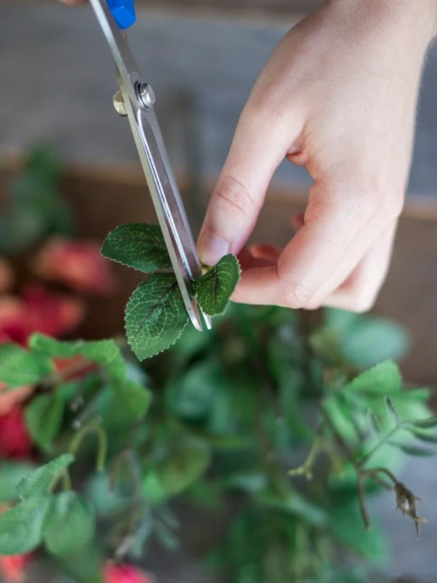 Next, cut the leaves off the bouquets.