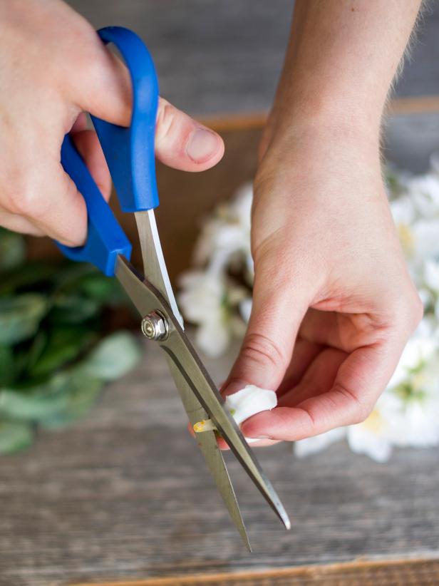If a small amount of stem remains on the underside of the flower, cut it off with scissors. You want the bottom of the flowers to be as flat as possible so they're easy to attach to the harness.