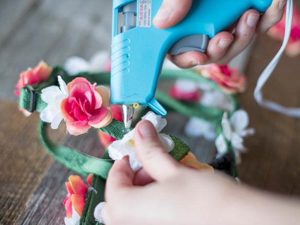 Fill in the gaps between flowers with leaves. Start with a dab of hot glue.
