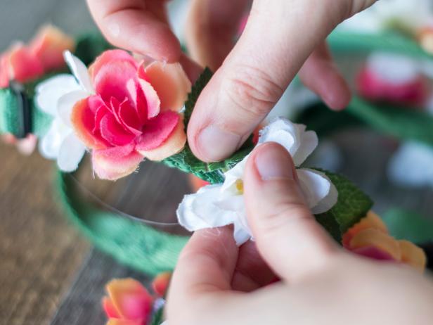 Fill in the gaps between flowers with leaves. Start with a dab of hot glue next to a flower, then tuck the leaf slightly under the flower for a more natural look. Continue overlapping the leaves until the harness looks lush and full.