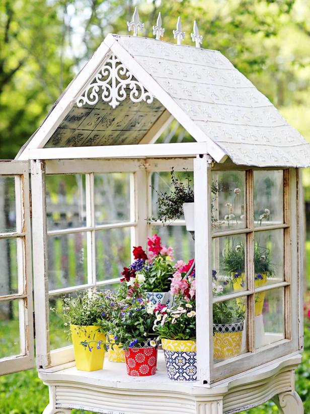 Not sure what to do with those salvaged windows? Turn them into a charming, cottage-inspired greenhouse.